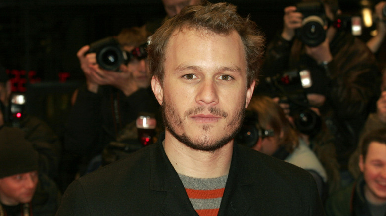 Heath Ledger wearing a striped sweater and black jacket at the premiere of "Candy" in Berlin