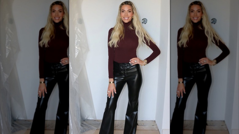 Heather Rae El Moussa smiling with hand on hip