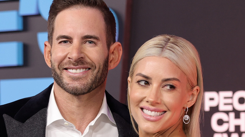 Heather Rae Young poses with husband Tarek El Moussa