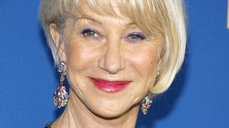 Helen Mirren smiles with bejeweled earrings