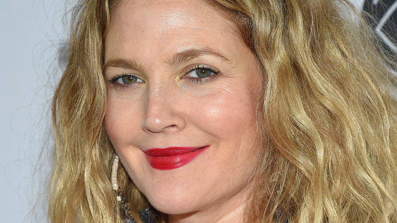 Drew Barrymore grinning with red lip