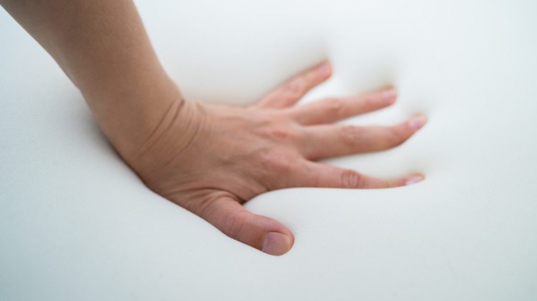 Hand testing a mattress