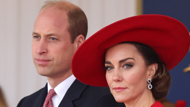 Prince William Princess Catherine looking serious