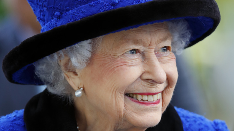 Queen Elizabeth looking to the side smiling