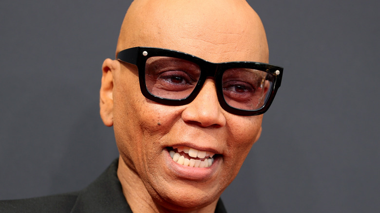 RuPaul Charles smiling on the red carpet