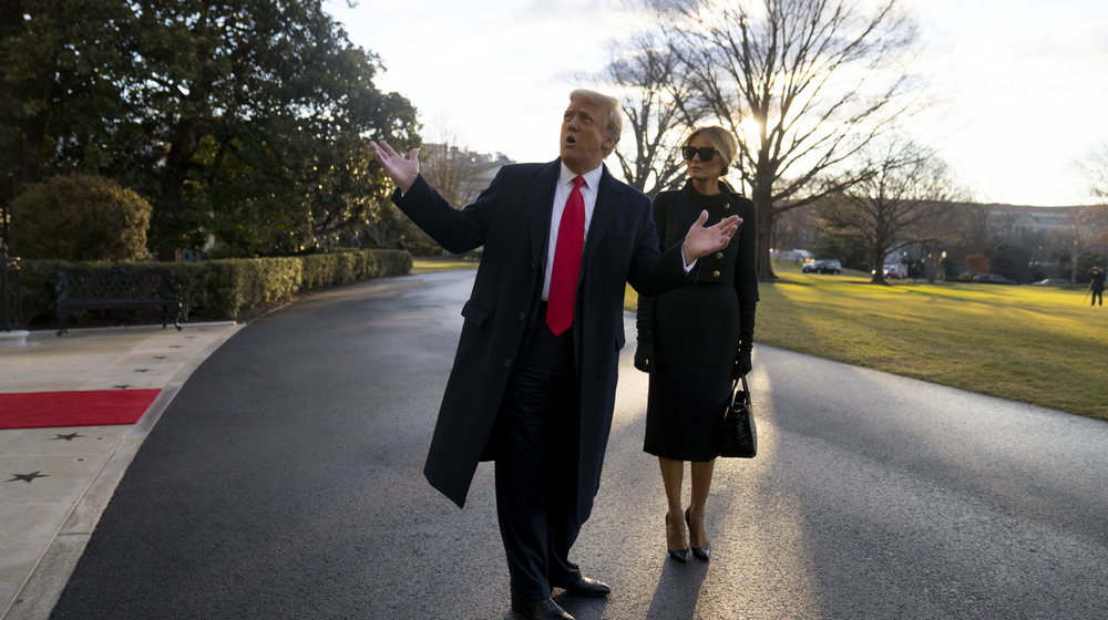 Donald Trump and Melania Trump leave the White House