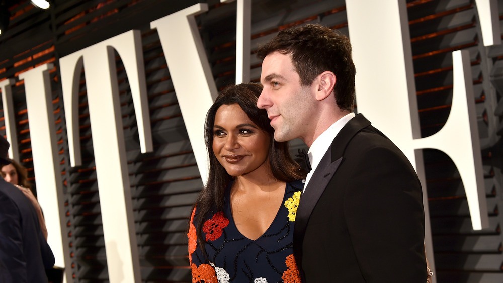 Mindy Kaling and BJ Novak posing at Vanity Fair Oscar party