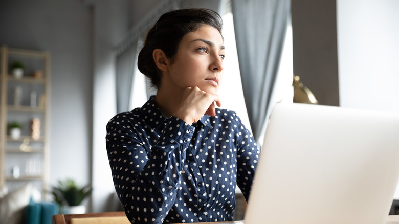 woman looking indecisive