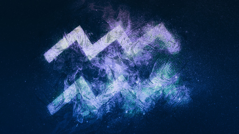 Aquarius sign on night background