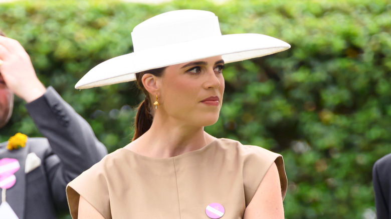 Princess Eugenie, wearing a large white hat, at the Royal Ascot 2025