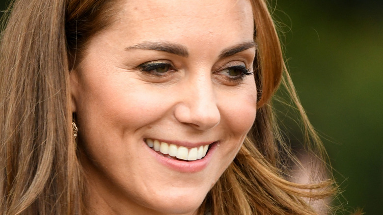 Kate Middleton smiling looking away from camera