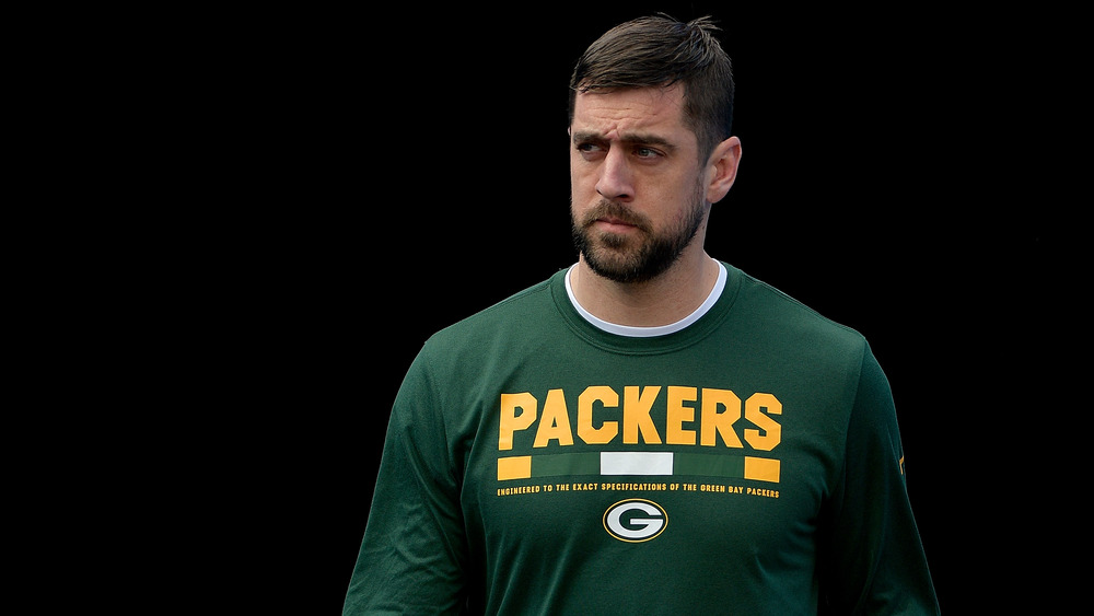 Aaron Rodgers wearing a Packers shirt