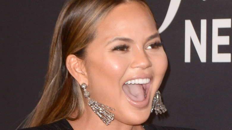 Chrissy Teigen laughs enthusiastically