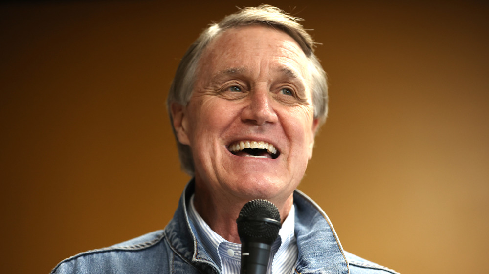 David Perdue smiling while speaking