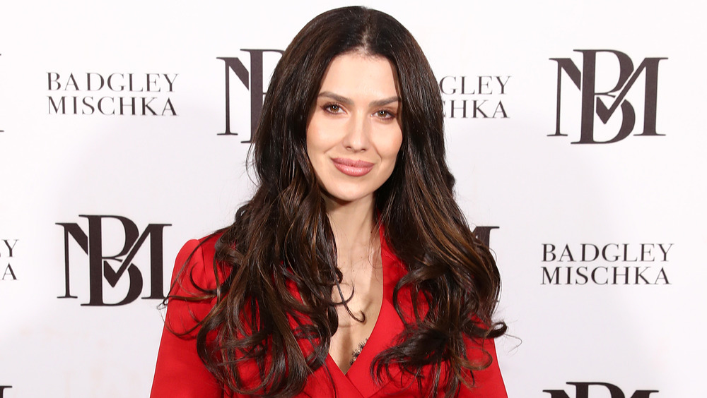 Hilaria Baldwin smiling in red