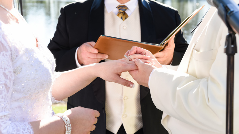 wedding officiant with the bride and groom