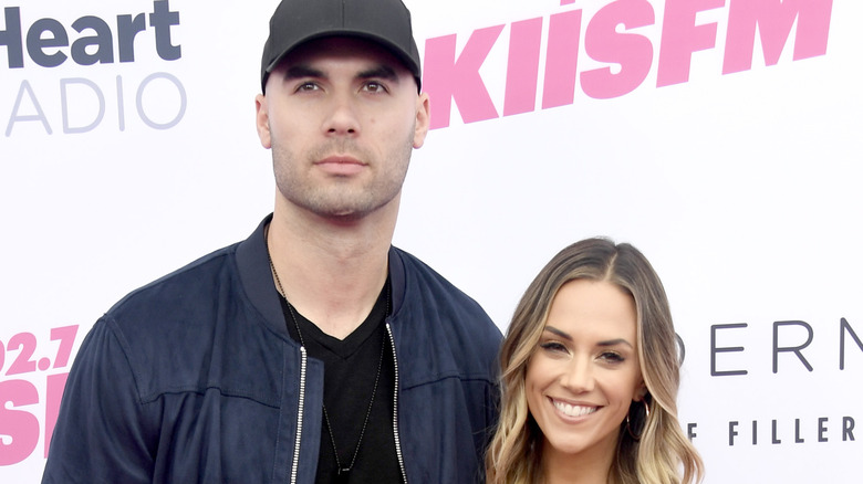Jana Kramer and Mike Caussin snuggle up on the red carpet