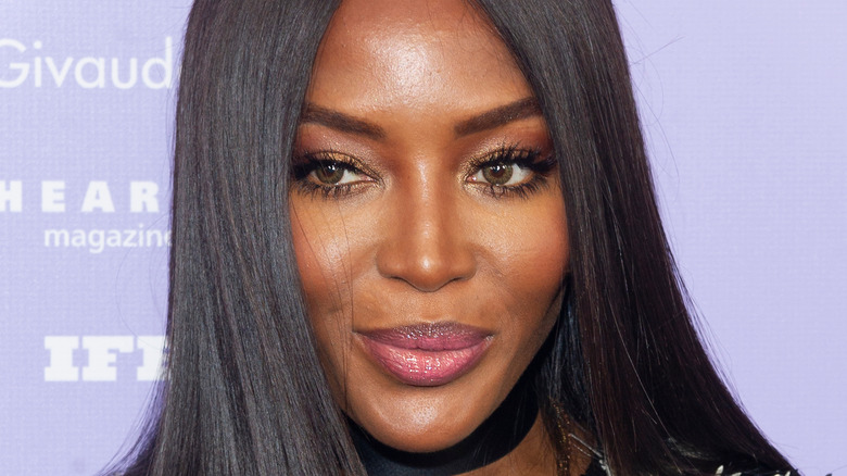 Naomi Campbell grinning with hair down