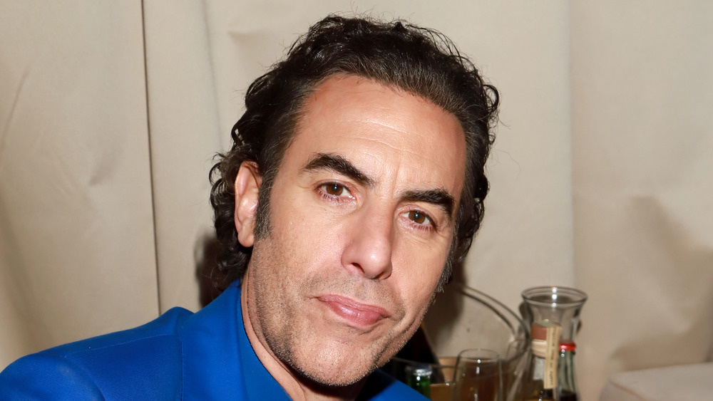 Sacha Baron Cohen poses at a Golden Globes party