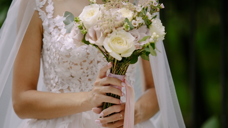 bride holding a wedding bouquet 
