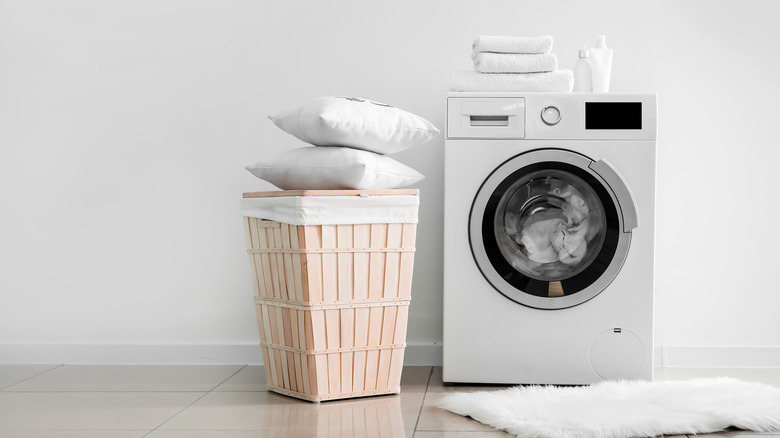 Pillows next to a washing machine