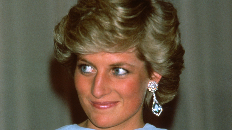 Princess Diana smiling while having her picture taken