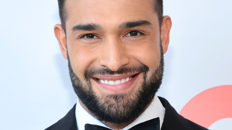 Sam Asghari smiling 