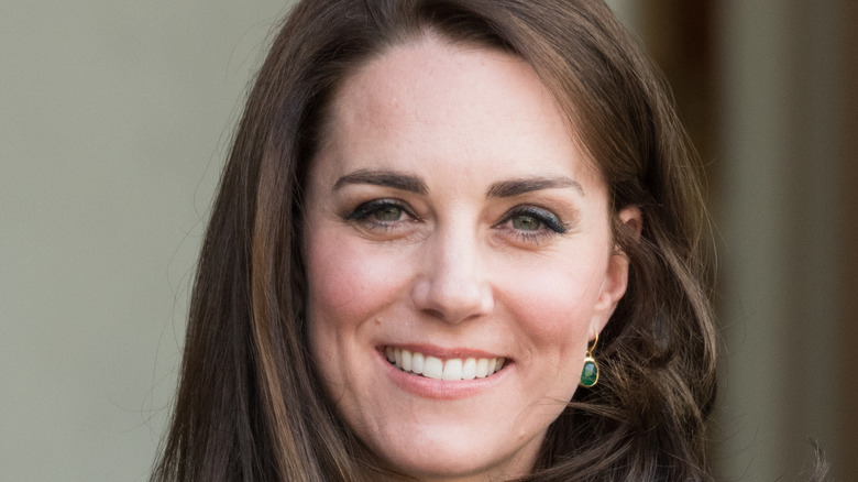 Kate Middleton wearing green earings