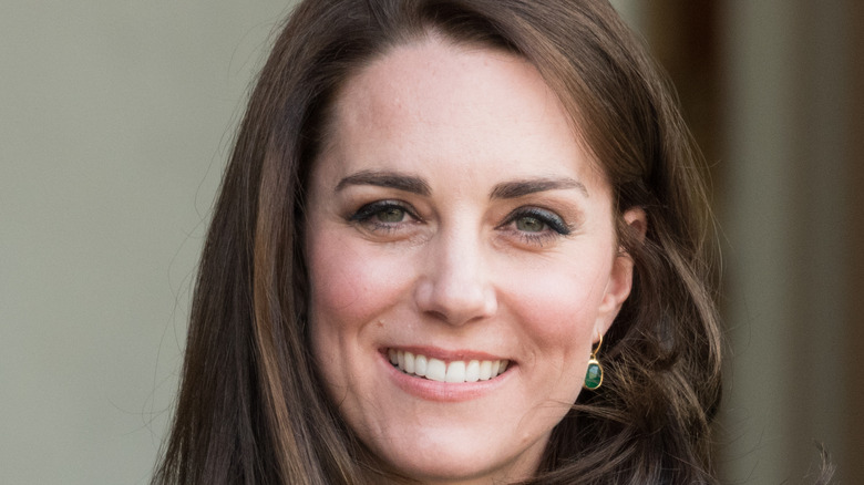 Kate Middleton wearing green earings