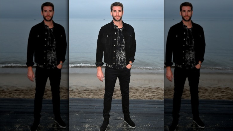 Liam Hemsworth posing for a picture 