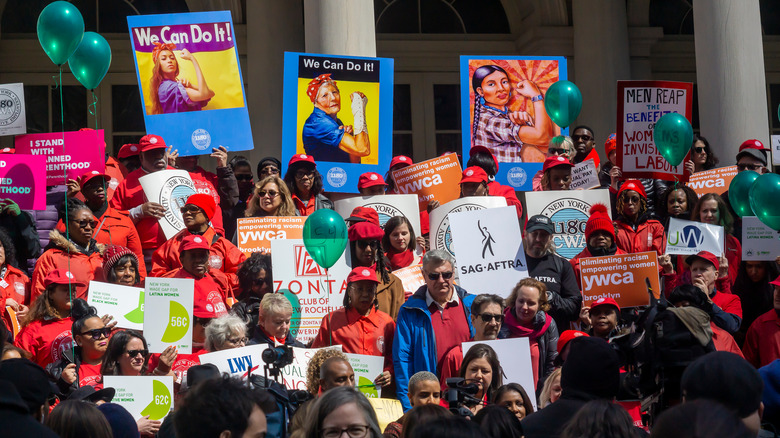 People protesting against gender pay disparity