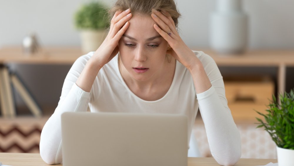 sad woman at computer