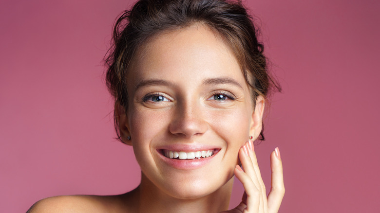 A woman smiling.