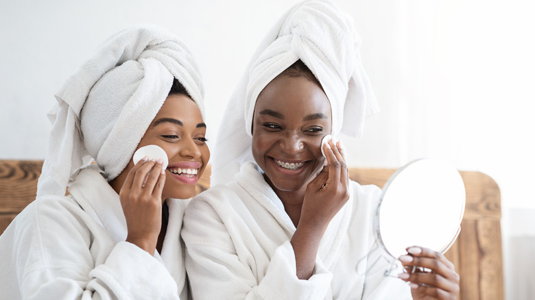 women applying toner