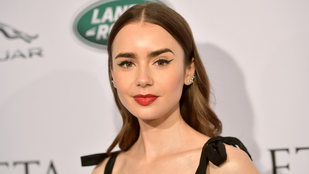 Lily Collins smizing on red carpet