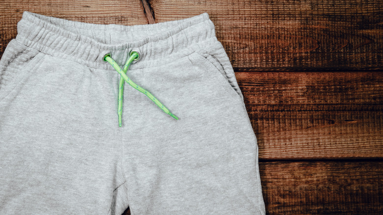 sweatpants on a wooden background 