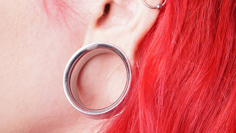 Stretched earlobe with gauge