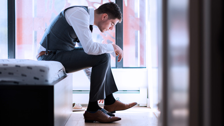 Man putting shoes on