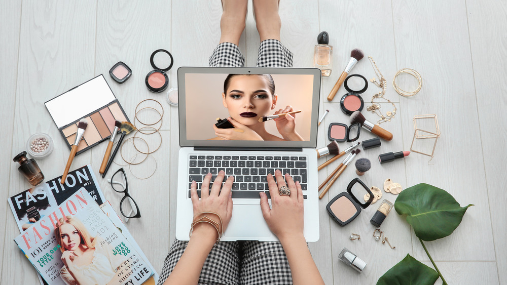 a woman looking at how to contour with makeup 