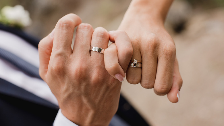 Couple with rings on their fingers