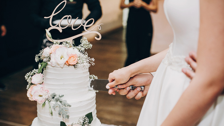 Couple cutting a cake