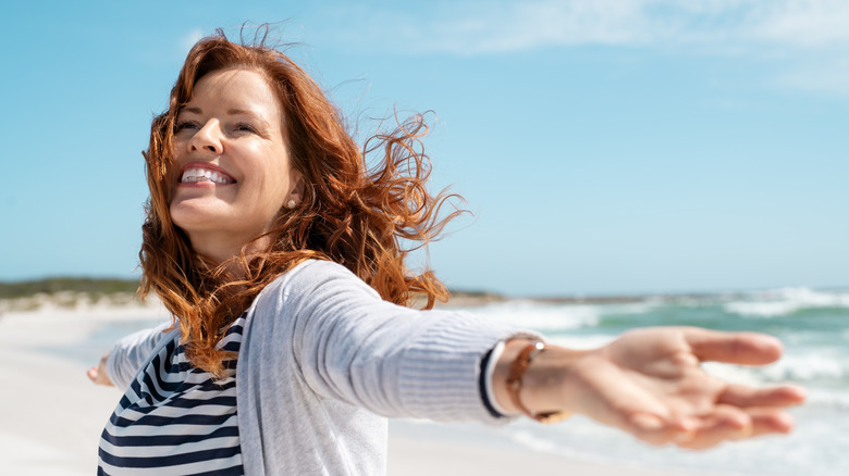 A happy woman on the beach 