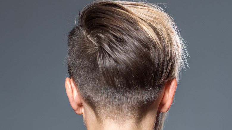 An undercut on the side and back of a woman's head