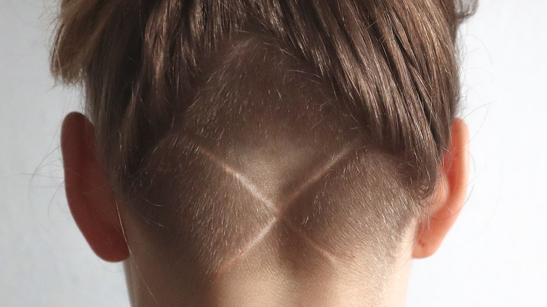 An "X" undercut in a woman's hair