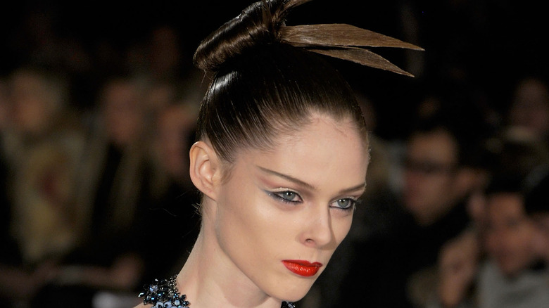 model wearing hair in spiky bun