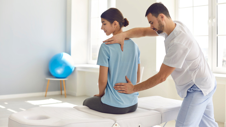 chiropractor with a patient