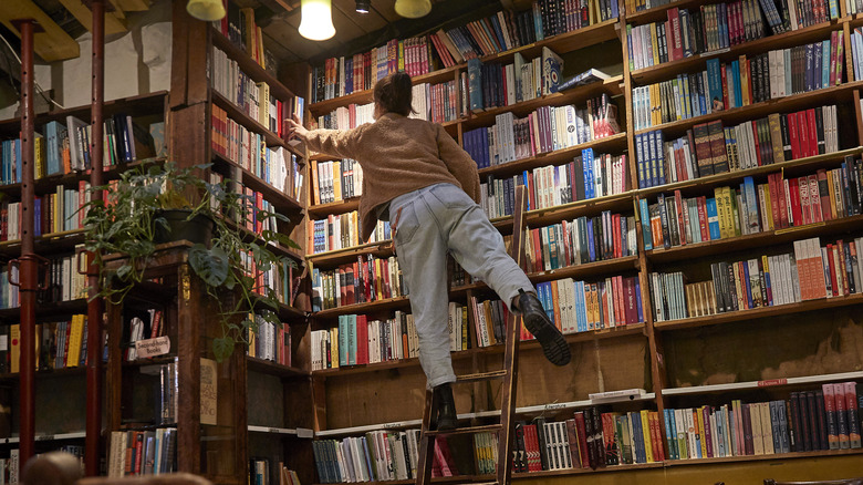 Librarian organizing books