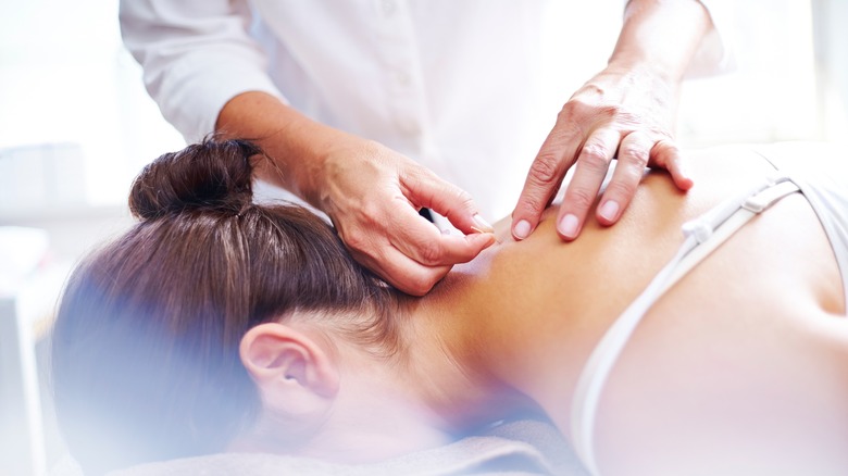 acupuncturist with a patient