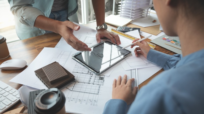 Interior designers sketching plans