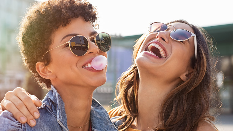 Two young women laughing